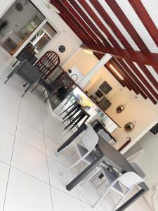 a dining room with chairs and a table at Co and co habitation in Lamentin