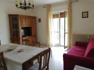 a living room with a table and a couch at Biagio and Marias house in Trecchina