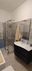 a bathroom with a shower and a sink and a tub at Biagio and Marias house in Trecchina +27 photos