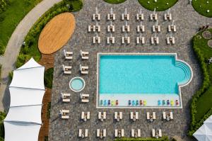 an aerial view of a swimming pool and a cruise ship at Sheraton Istanbul Atakoy Hotel in Istanbul