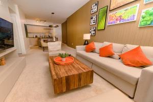 a living room with a couch and a coffee table at Lyfe Resort Hollywood, Florida in Hollywood