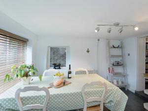 a dining room with a table and two chairs at Horseshoe House - Ukc2743 in Watton