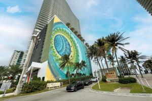 a building with a mural on the side of it at Lyfe Resort Hollywood, Florida in Hollywood