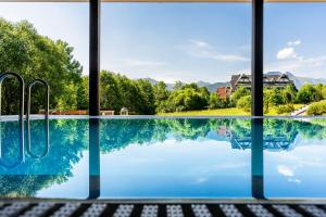 a swimming pool with a view of the mountains at Rezydencja Zakopane in Zakopane