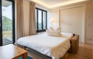 a hotel room with a bed and a large window at Princess in Binz