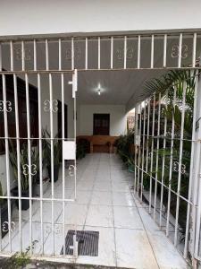an entrance to a building with a metal gate at Casa Completa no Centro de Soure com Wi fi e Garagem in Soure
