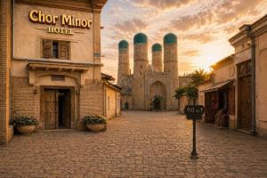 an empty street in front of a building with a mosque at Hotel Chorminor 110 m to Old Town GET EARLY CHECK IN AND CHECK OUT in Bukhara