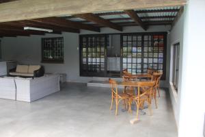 a dining room with a table and chairs at Kanyane @ Graskop in Graskop