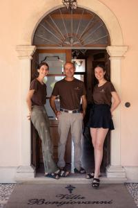 a man and two women standing in a doorway at Villa Bongiovanni in San Bonifacio +43 photos