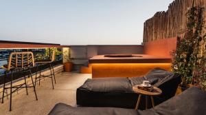 a living room with a couch and a table at Athens Odeon Hotel in Athens +47 photos