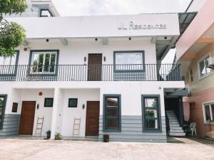 a white building with a sign that reads reserves at 1BR Apartment Beach Getaway Perfect for Couples in Bangcusay