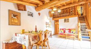 a kitchen and dining room with a table and chairs at Chalet le Vernès Marmotte in Bonneval-sur-Arc
