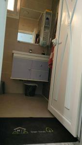 a small bathroom with a sink and a counter at Jijel in Jijel