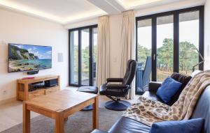 a living room with a couch and a chair at Eden in Binz