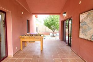 a room with a table in the middle of a building at Cuencaloft Villa Los Perales in Villalba de la Sierra +30 photos