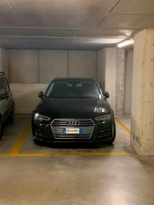 a black car parked in a parking garage at Rivacentro 4 in Riva del Garda