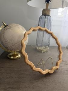 a wooden frame shaped like a heart next to a lamp at Crewe Corner D in Crewe