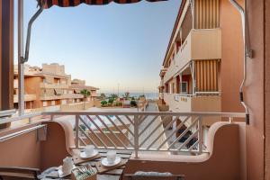 a balcony of a building with a view of the ocean at Residencial La Gomera in Puertito de Güímar