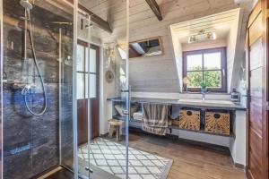 a bathroom with a shower and a sink at NatureHouse Čeřeniště in Malečov +51 photos