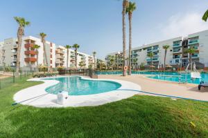 an image of a swimming pool at a resort at Apartamento de lujo Almerimar in Almerimar