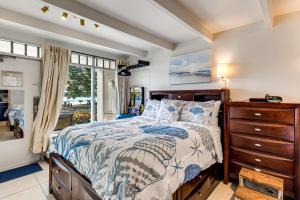 a bedroom with a bed and a dresser and a window at Dolphin & Manatee Cove Condo: Beach Access + More! in Gulf City +28 photos