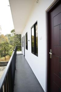 a corridor of a school building with a door at Vagamon leafhill mountain view holidays in Vagamon +13 photos