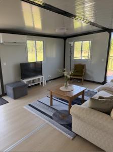 a living room with a couch and a coffee table at Peppa Puhkemaja in Vahtrepa