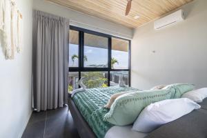a bedroom with a bed and a large window at Solindo Suite in Marbella +24 photos