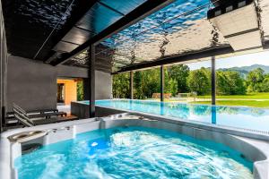 a swimming pool with a hot tub in a house at Rezydencja Zakopane in Zakopane