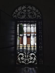 an open window with a view of a balcony at Casa Rural El Pergareo in Cazalla de la Sierra