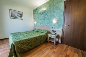 Postel nebo postele na pokoji v ubytování Park Hotel Perù ***S