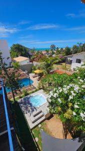 an overhead view of a swimming pool in a resort at Shanti Om Refúgio Pousada e Yoga in Cascavel