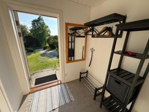 a room with a view of a window and a ladder at Övertun in Hamburgsund