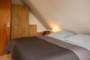 a bedroom with a bed in a attic at Nordseeperle in Wangerland