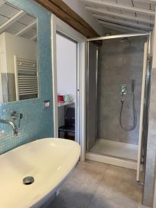 a bathroom with a shower and a white sink at BnB Centro Centro in Ascoli Piceno