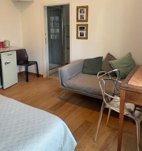 a living room with a couch and a table at BnB Centro Centro in Ascoli Piceno