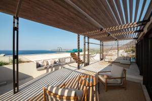 a balcony with a view of the ocean at Mitsis Summer Palace in Kardamaina