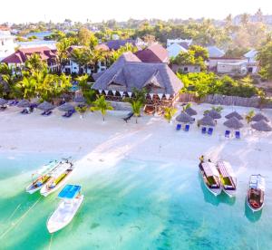 an aerial view of a resort with boats in the water at Sansi Kendwa Beach Resort in Kendwa