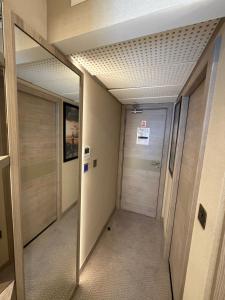a hallway with a door in a building at Mabledon Court Hotel in London