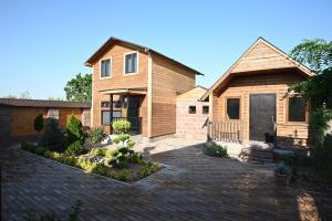 a house with a brick driveway in front of it at ARBAT house LUXURY in Arbatʼ