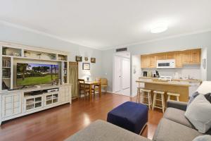 a living room with a couch and a tv at 2479 Shipwatch in Kiawah Island