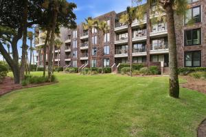 an apartment building with a lawn in front of it at 2479 Shipwatch in Kiawah Island