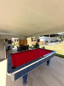 a pool table in the middle of a backyard at Villa Morivivi Couples with pool in Tierras Nuevas Poniente +23 photos