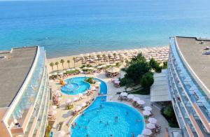 an aerial view of a resort with a swimming pool and the beach at Sandy Bay Resort - All Inclusive Private Beach Hotel in Sveti Vlas