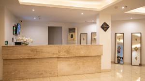 a lobby of a store with a reception counter at The Chapter Hotel, Vasant Kunj in New Delhi