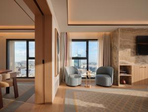 a living room with two chairs and a table at The View Rabat in Rabat