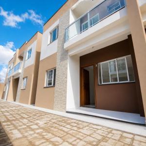 a facade of a house with a driveway at Refúgio da Praia in Caucaia