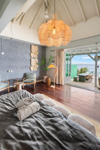 a bedroom with a bed and a living room at BijBlauw in Willemstad +131 photos