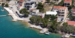 an aerial view of a harbor with boats in the water at Open Sea Apartmani in Grebaštica