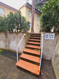 a set of stairs in front of a house at Caletta Apartments in Castiglioncello